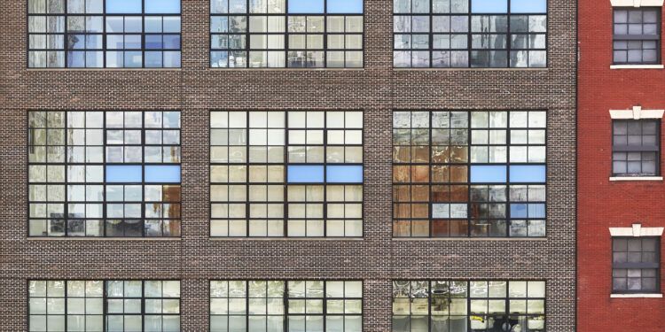 Facade of an old brick building in downtown New York, USA.